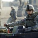 Soldiers build an assault, float bridge outside Camp Taji