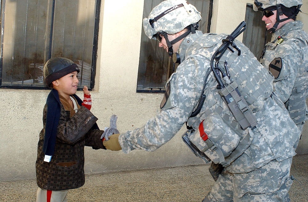 Soldiers Hand Out School Supplies at a Boys' School in Mosul