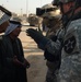 Iraqi police and U.S. Soldiers conduct a cordon and search