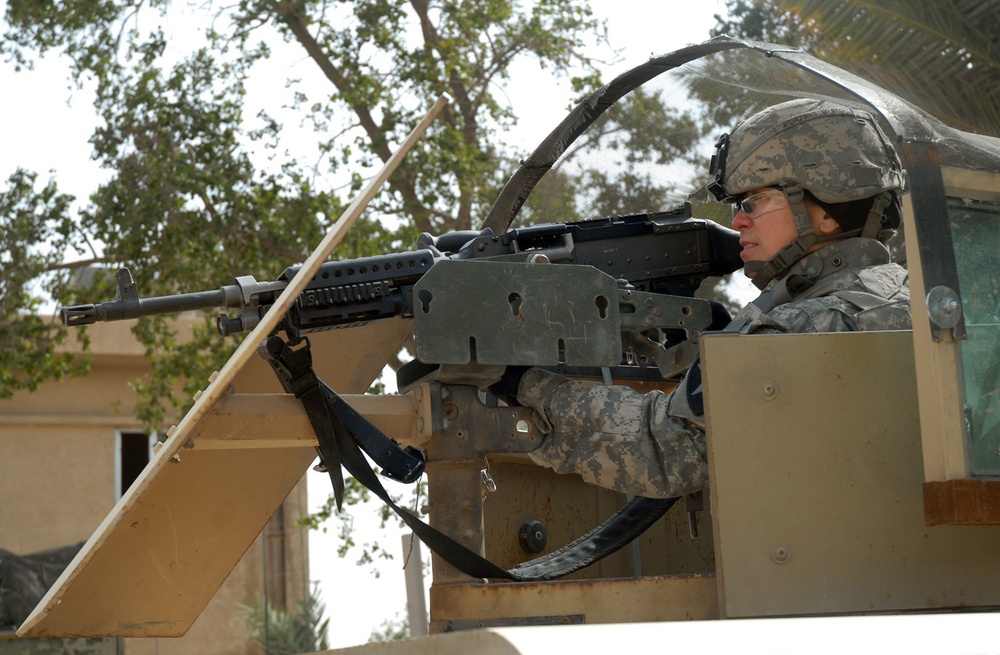 Woman Gunner Helps Protect Security Detachment