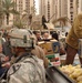 Soldiers search for weapons and give humanitarian aid