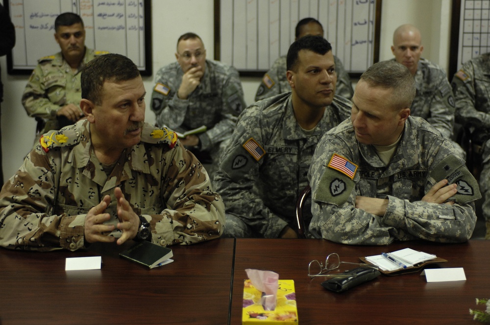 U.S. Soldiers speak with Iraqi leaders