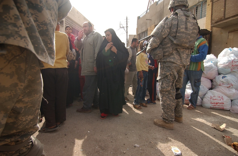 Soldiers provide humanitarian aid to citizens in Baghdad