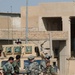 Soldiers speak with locals in Samarra