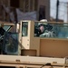 Soldiers speak with locals in Samarra