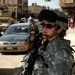 Soldiers speak with locals in Samarra