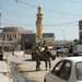 Soldiers speak with locals in Samarra