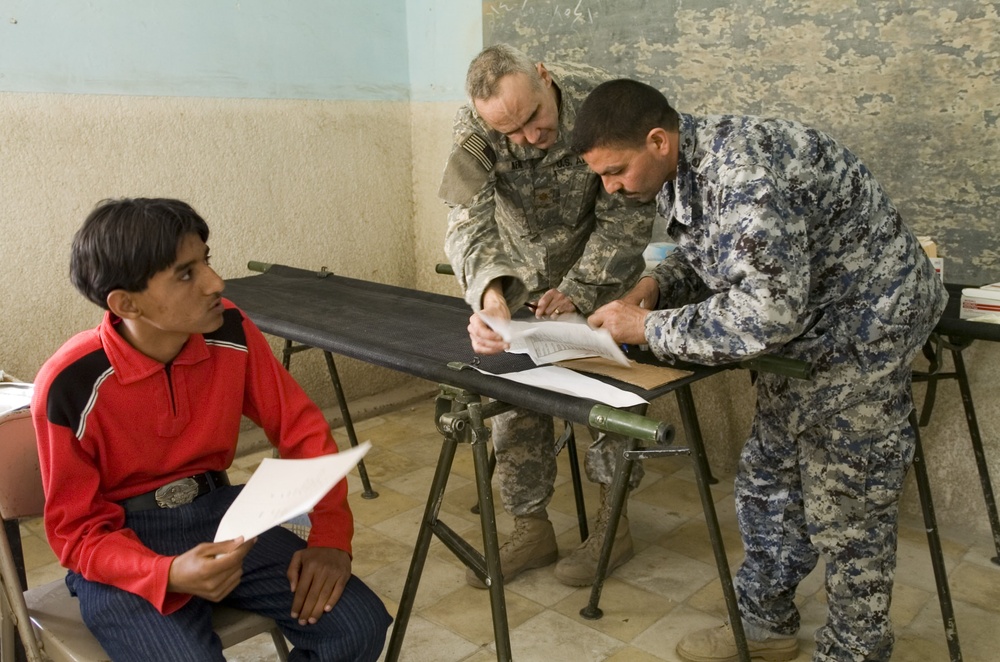 Paratroopers and Iraqi Police Provide Medical Assistance to Sadr City Resid