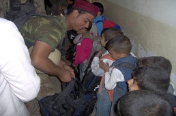 National Police, MND-B Soldiers drop off school supplies