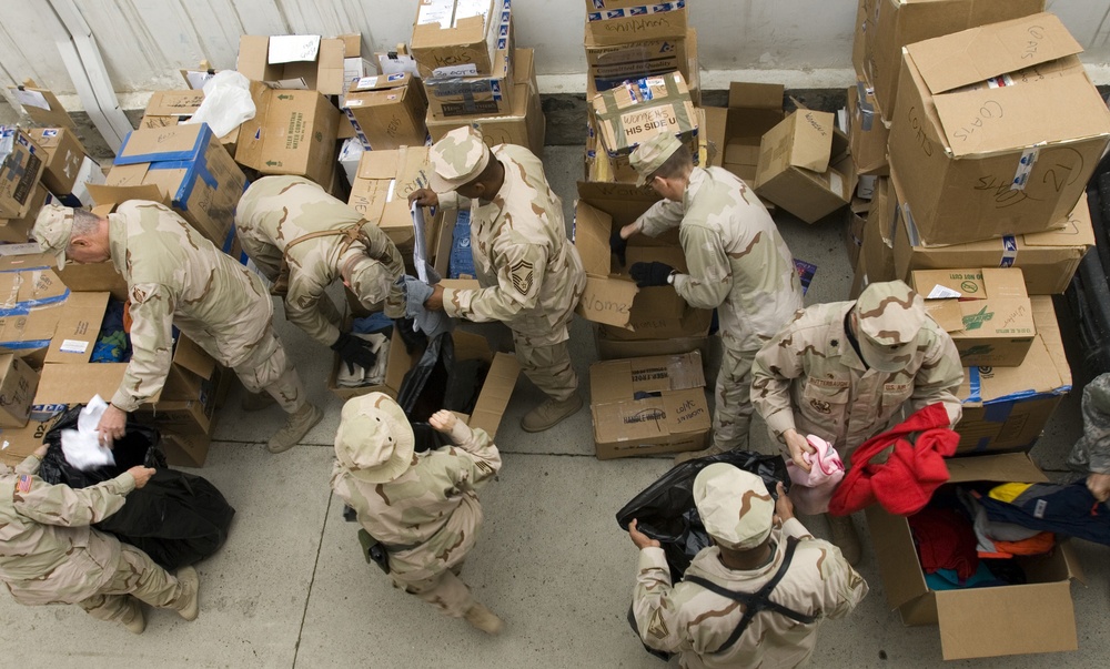 Joint forces volunteer time to donate goods