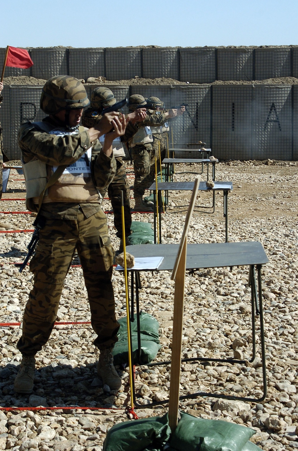 Mongolian soldiers fire Makarov pistols during competition