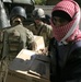 Fallujah police hands out school supplies
