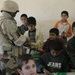 Fallujah police hands out school supplies