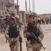 Iraqi police, U.S. Soldiers patrol Palestinian street