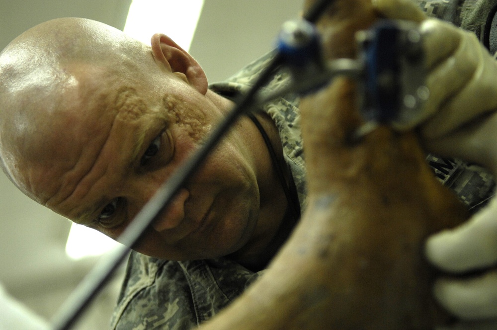 6th Squadron, 9th U.S. Cavalry medic treats wounds at FOB Normandy