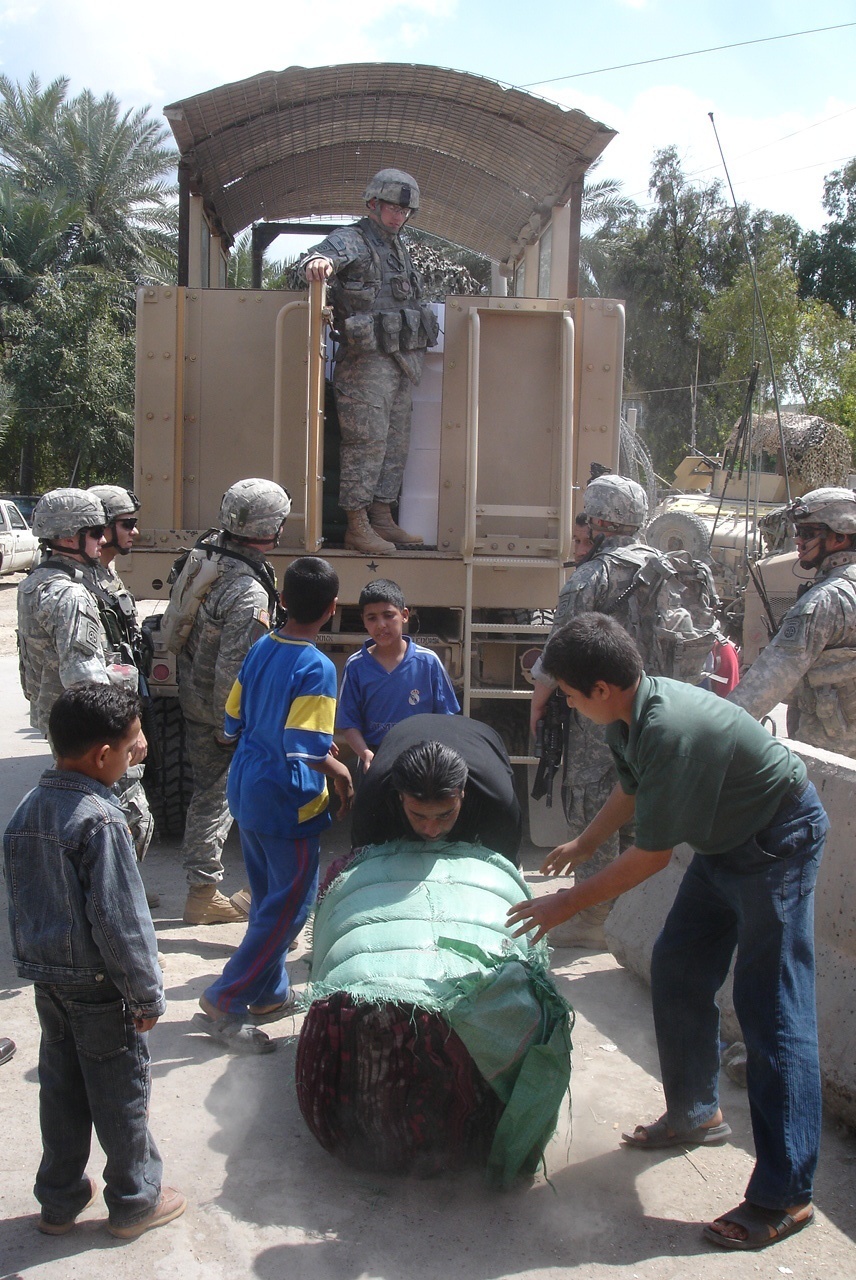 Humanitarian aid brings smiles to Baghdad neighborhood