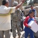 Humanitarian aid brings smiles to Baghdad neighborhood