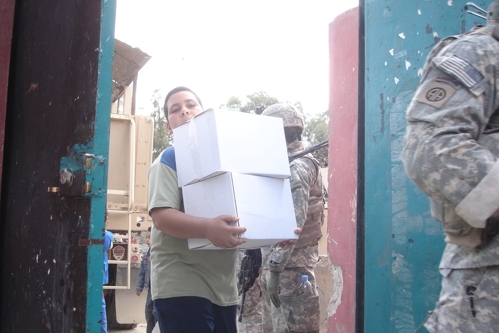 Humanitarian aid brings smiles to Baghdad neighborhood