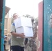 Humanitarian aid brings smiles to Baghdad neighborhood