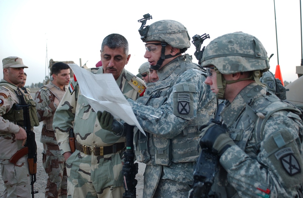 Searching for signs of insurgents in Lutafiyah