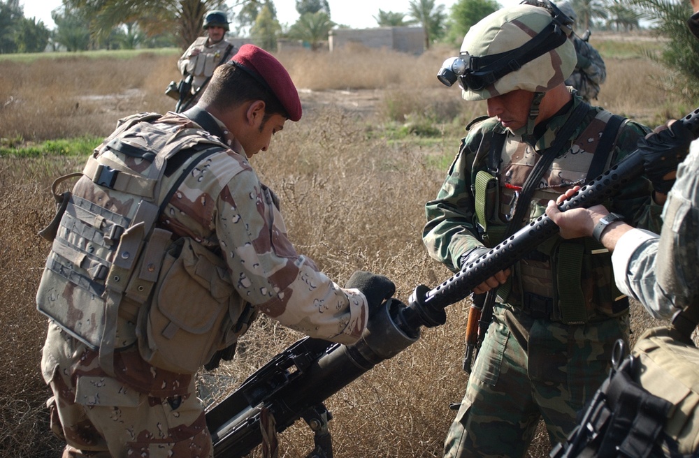 Searching for signs of insurgents in Lutafiyah