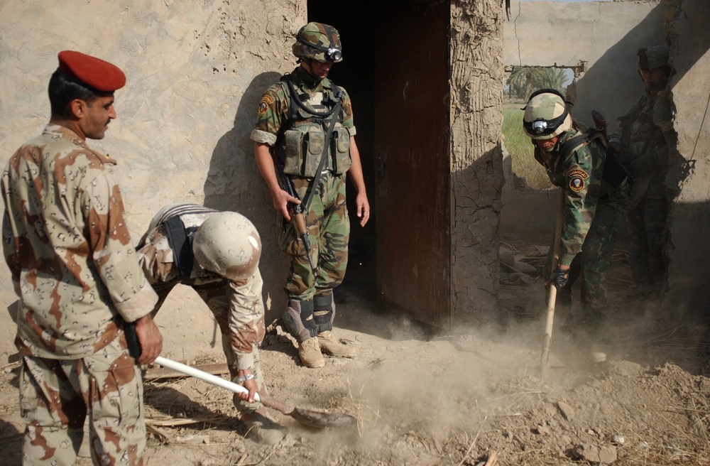 Searching for signs of insurgents in Lutafiyah