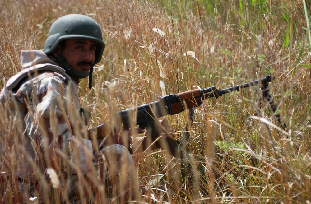 Searching for signs of insurgents in Lutafiyah