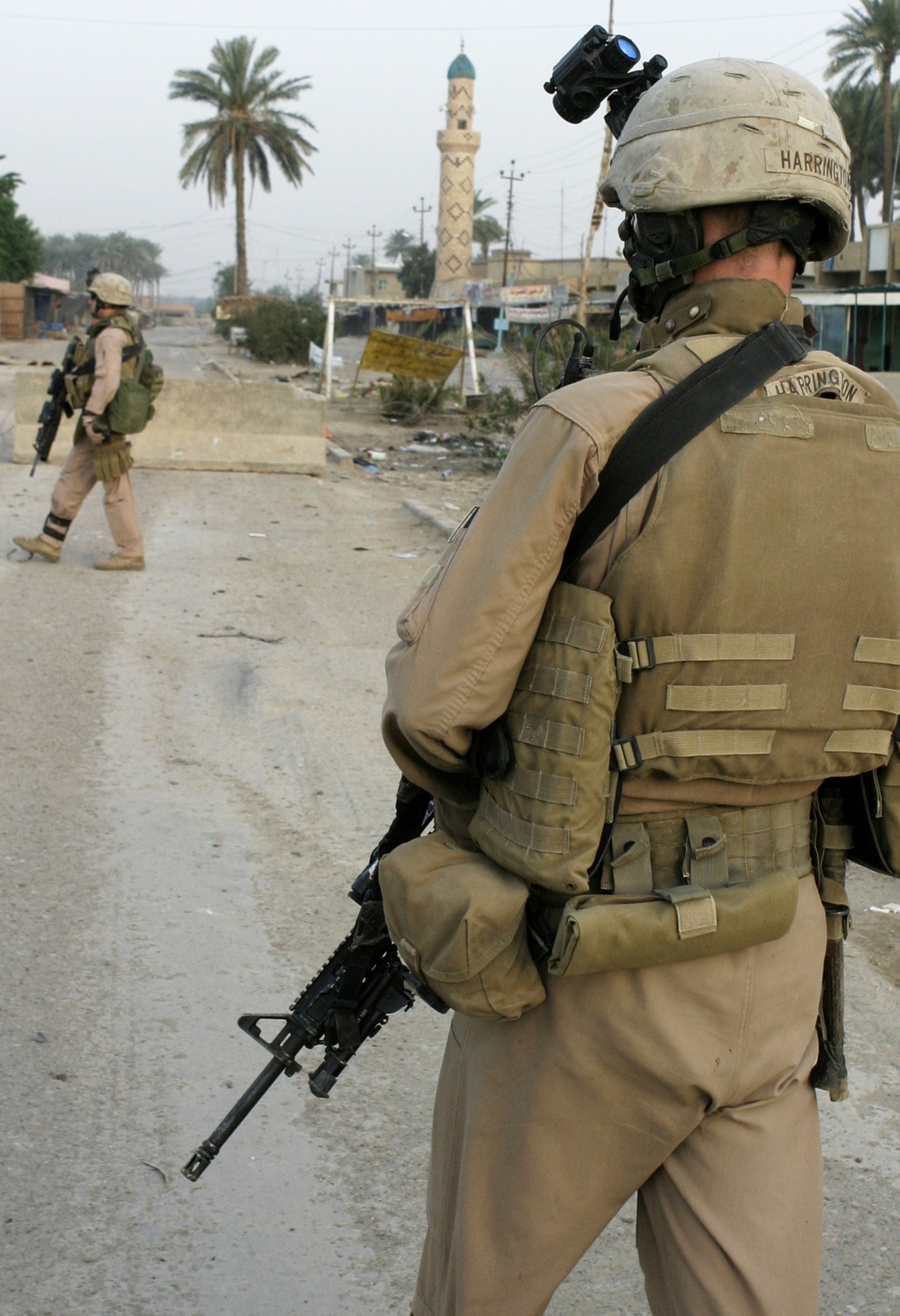 Patrolling the marketplace after an attack in Saqlawiyah