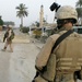 Patrolling the marketplace after an attack in Saqlawiyah