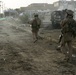 Patrolling the marketplace after an attack in Saqlawiyah