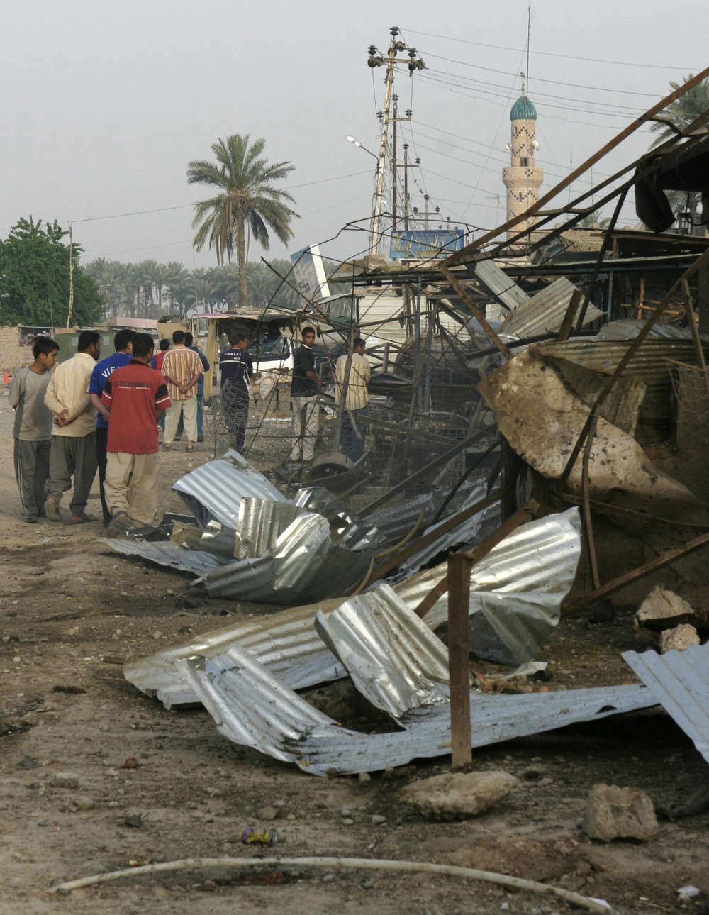 Patrolling the marketplace after an attack in Saqlawiyah