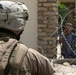 Patrolling the marketplace after an attack in Saqlawiyah