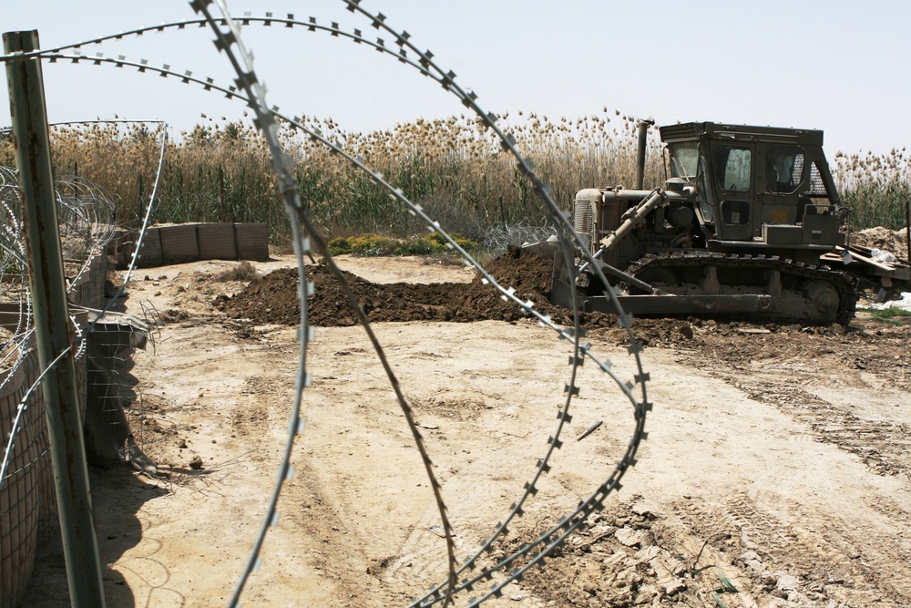 Patrolling the marketplace after an attack in Saqlawiyah