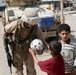 Patrolling the marketplace after an attack in Saqlawiyah