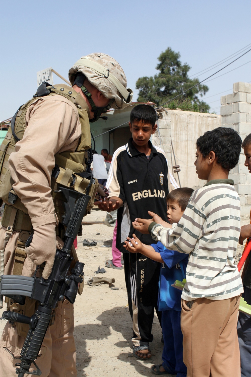 Patrolling the marketplace after an attack in Saqlawiyah