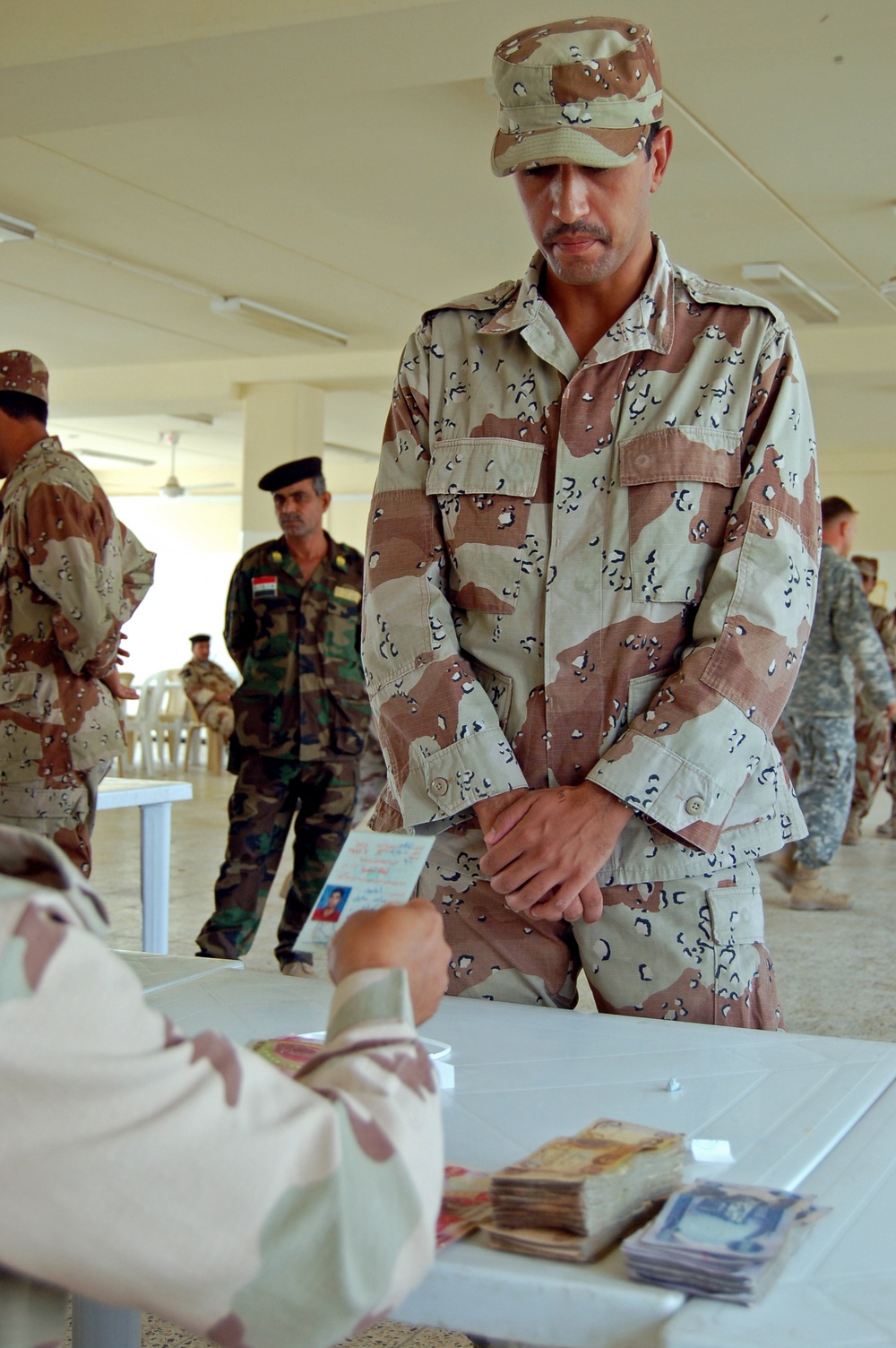Iraqi Soldier Collects Pay