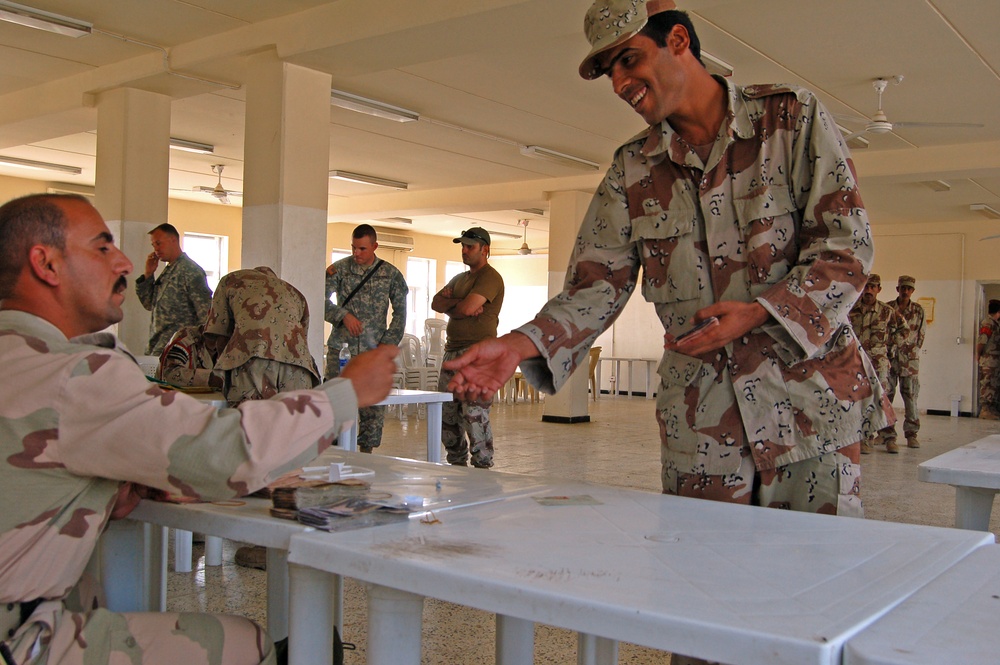 Iraqi Soldier Collects Pay