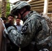 Soldiers look after Iraqis following insurgent attack