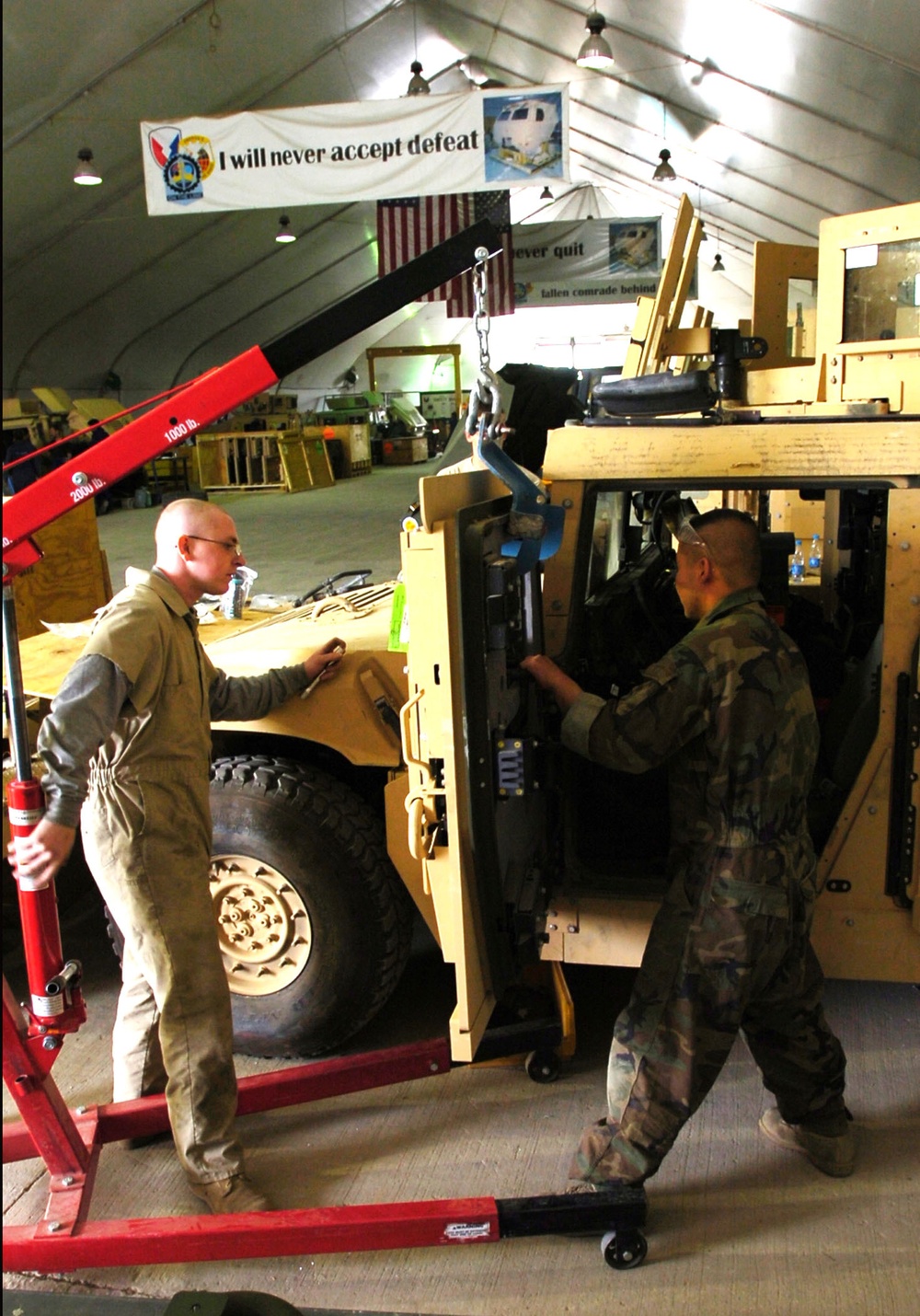 82nd CAB mechanics install Frag- 5 Armor Field kits