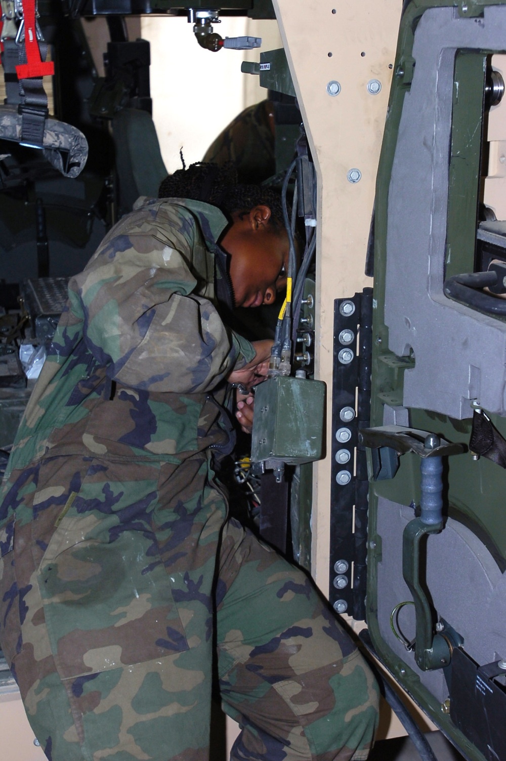 82nd CAB mechanics install Frag- 5 Armor Field kits