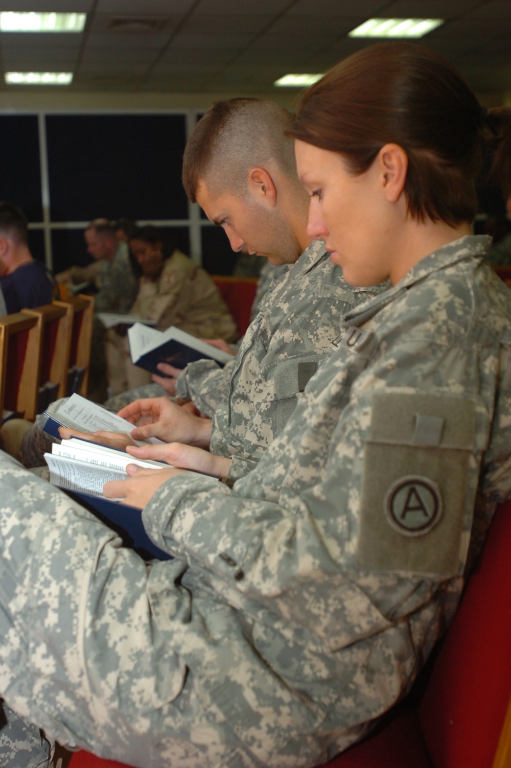 At Camp Buehring, Soldiers pray before heading into Iraq