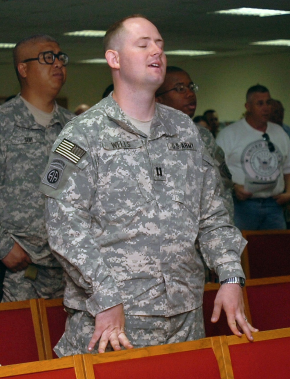 At Camp Buehring, Soldiers pray before heading into Iraq