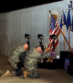 Soldiers pay respects to fallen comrades