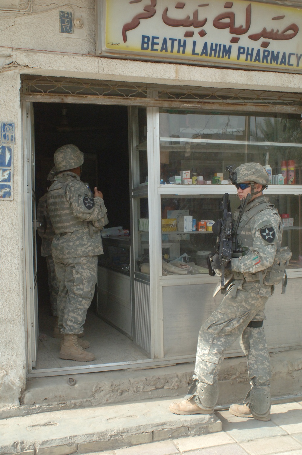 Soldiers Patrol Local Market