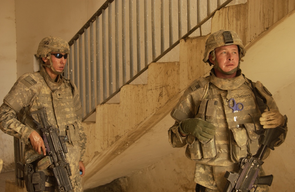 U.S. Army Military Police work with Iraqi police