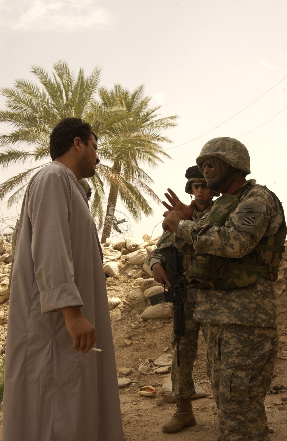 U.S. Army Military Police work with Iraqi police