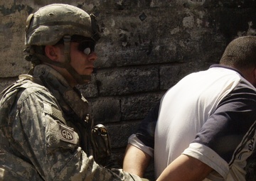 Soldiers Sweep and Search During Operation Ant Hill
