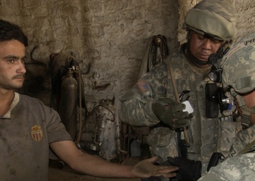 Soldiers Sweep and Search During Operation Ant Hill