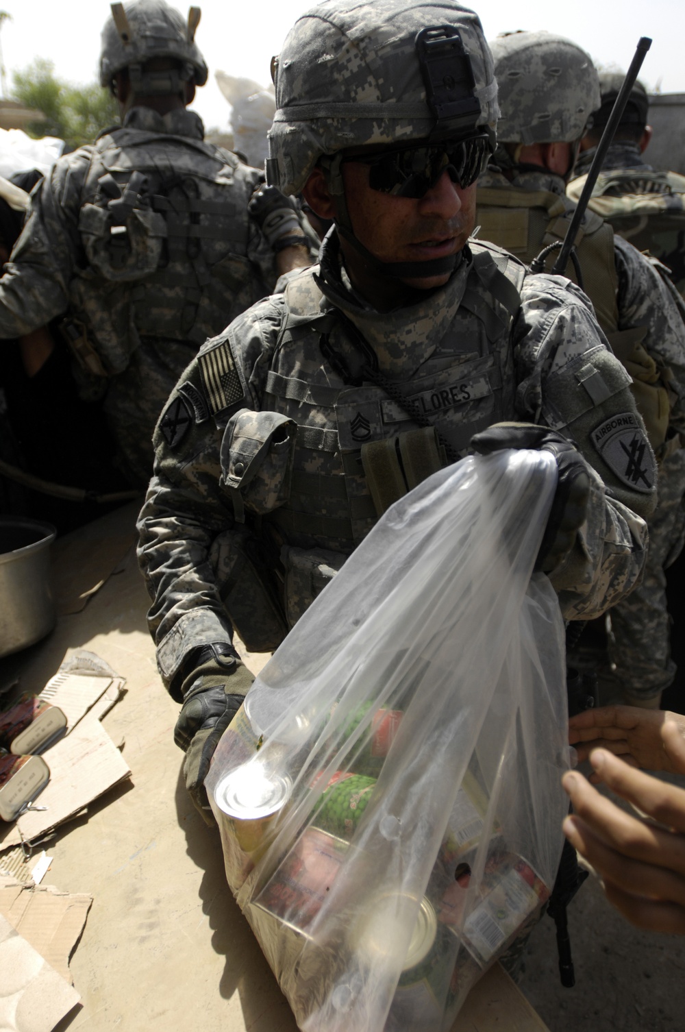 Tactical PsyOps Team Hands Out 1500 Pounds of Food