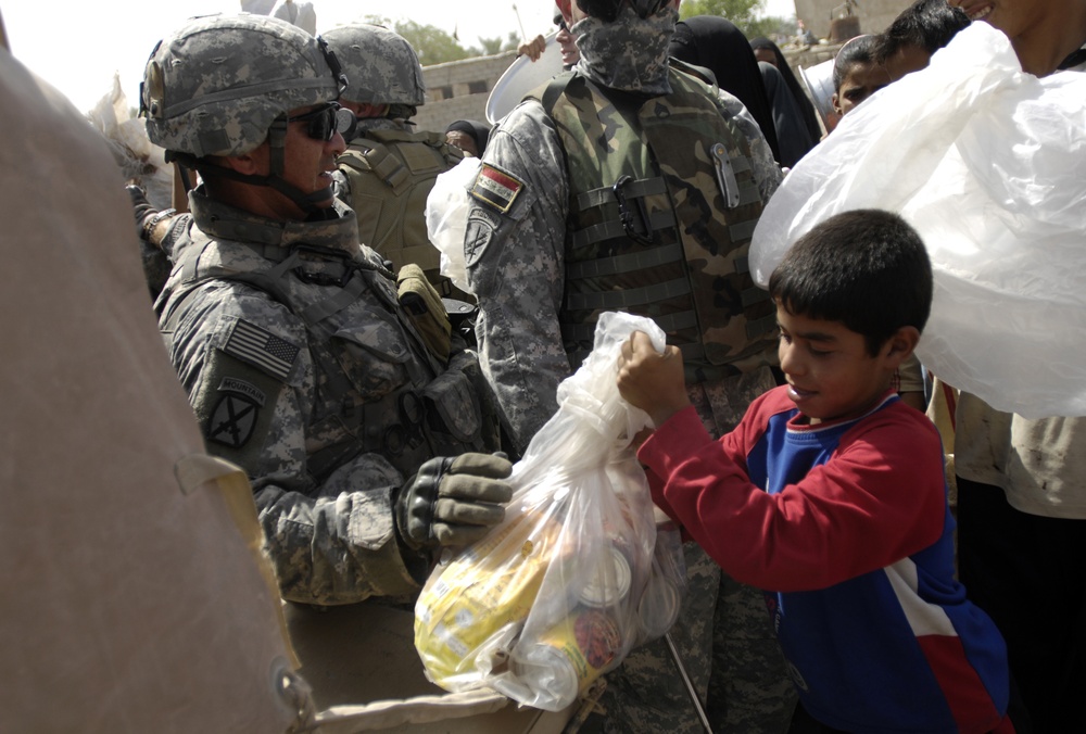 Tactical PsyOps Team Hands Out 1500 Pounds of Food